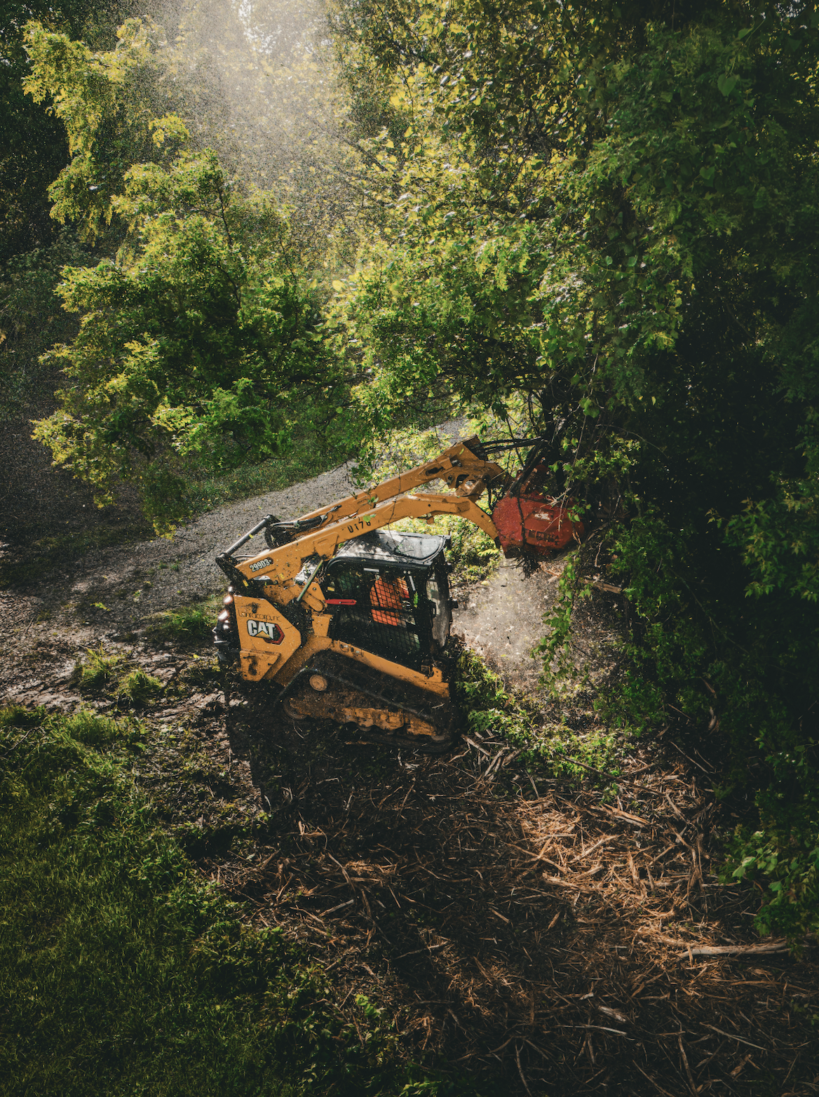 Land agent overseeing work site wearing a vest that says "Clearing the way"
